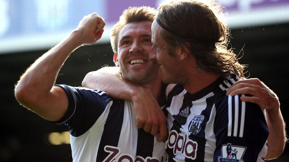 Gareth McAuley celebrates