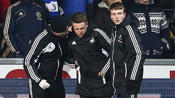 The injured Swansea ballboy gets attention