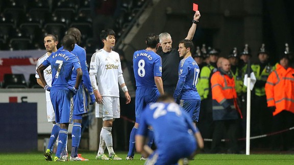 Chelsea's Eden Hazard receives a red card from referee Chris Foy for violent conduct