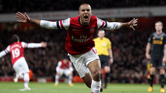 Theo Walcott celebrates netting the equaliser against Liverpool