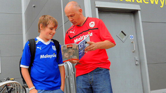 Cardiff City fans red shirt blue shirt