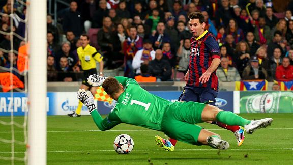 Joe Hart gets out quickly to save at the feet of Lionel Messi.