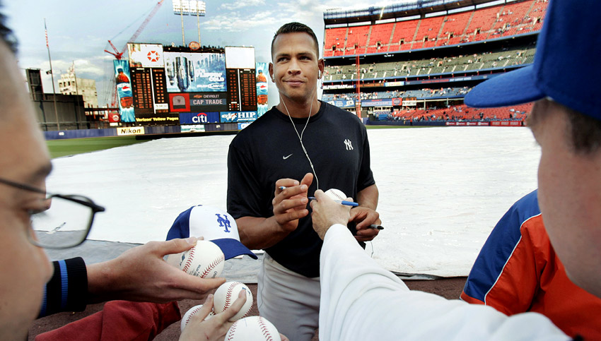 Alex Rodriguez signs autographs