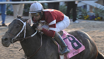 Pyro, with Shaun Bridgmohan aboard, wins the Grade 3, $300,000 Risen Star Stakes for 3-year-olds at Fair Grounds on Saturday.