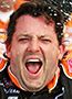 Spins, scraps and crazy fans; Stewart wins wild Watkins Glen