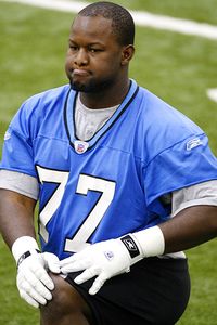 Gosder Cherilus #77 of the Detroit Lions looks on during rookie training camp at the Detroit Lions Headquarters and Training Facility on May 3, 2008 in Allen Park, Michigan.