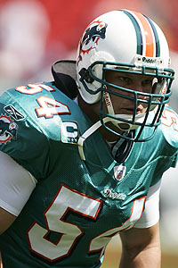 The Cowboys' Zach Thomas, who spent 12 seasons with the Dolphins, was voted the smartest defensive player in a poll of 31 NFL coaches.