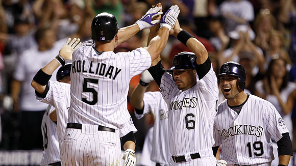 Colorado Rockies' Troy Tulowitzki slams his bat after striking out with two  runners on base to end the eighth inning in a scoreless baseball game  against the San Diego Padres, Thursday, April