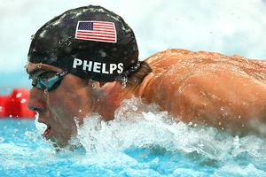 Michael Phelps leaves rivals trailing in his wake on his way to smashing his own 200 IM world record and placing him within two gold medals of breaking Mark Spitzs record of seven at a single Games.