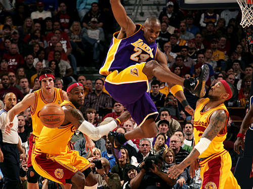 kobe bryant dunking on lebron james. LeBron James watches as