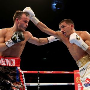 Lee Selby of Wales lands a punch on Evgeny Gradovich of Russia