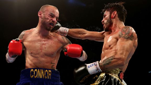 Kevin Mitchell of England and Jorge Linares of Venezuela exchange blows